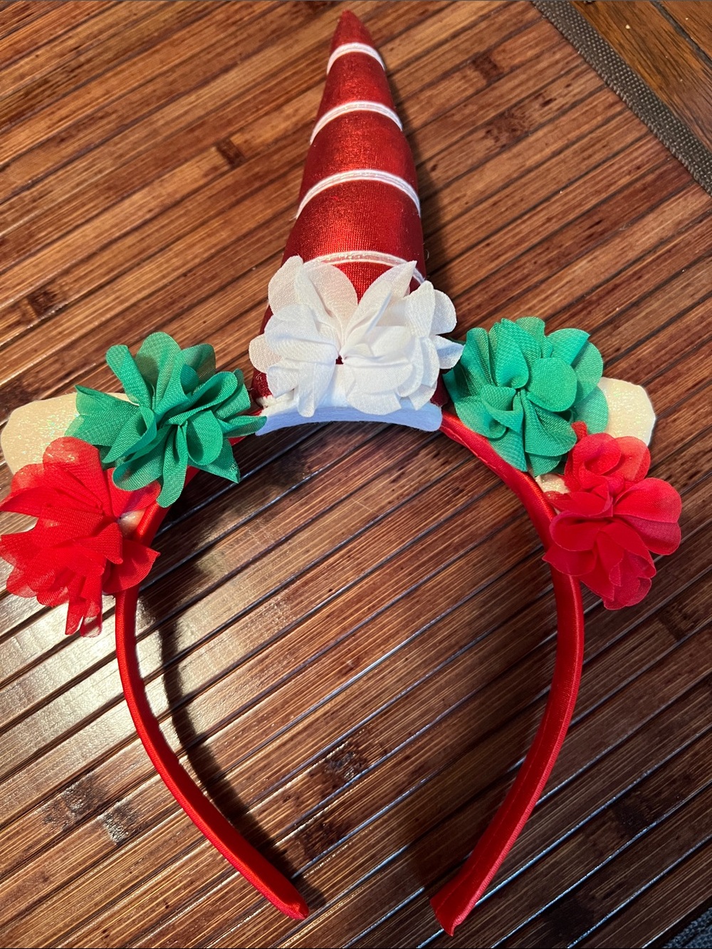 Festive Red Unicorn Headband with Green & White Floral Accents